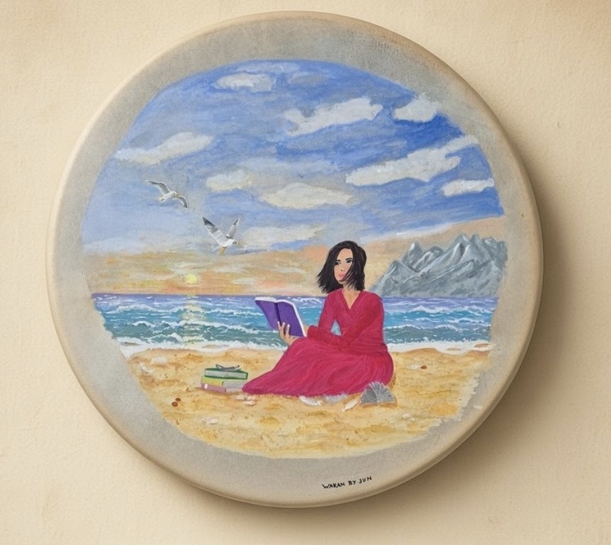 Beautiful woman by the sea